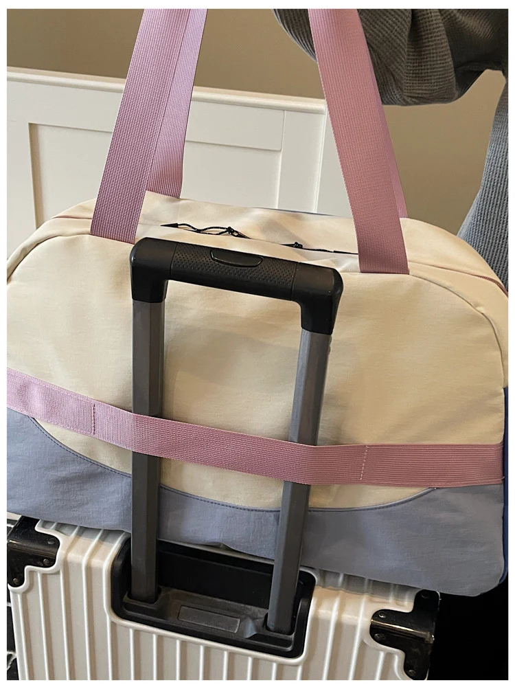 Pink sample — rear luggage sleeve; suitcase not included.